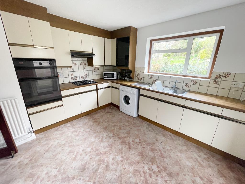 Lot: 87 - DETACHED BUNGALOW FOR IMPROVEMENT AND REPAIR - Kitchen with window to rear garden and door to side